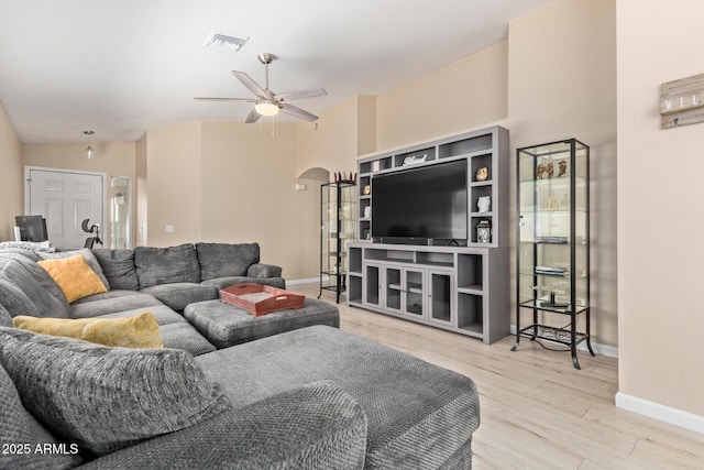 5018 W Wikieup Ln, Glendale, AZ 85308 - living room featuring arched walkways, wood finished floors, and ceiling fan