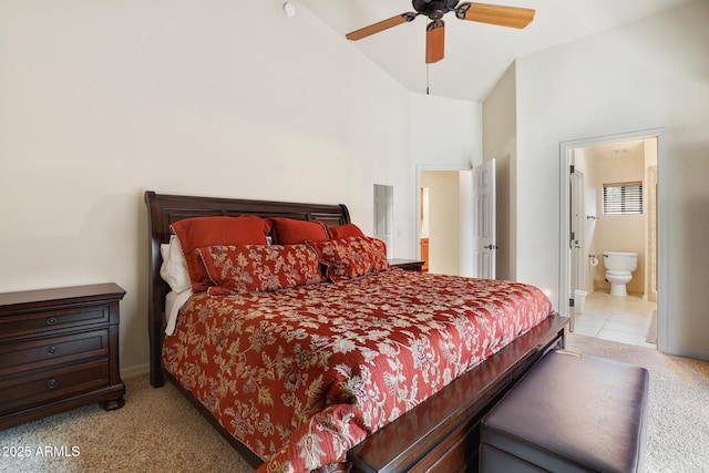 bedroom featuring ensuite bathroom, a ceiling fan, light carpet, high vaulted ceiling, and baseboards