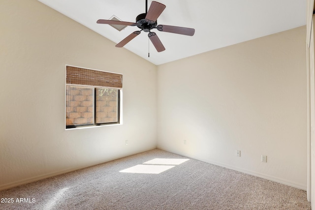 spare room with lofted ceiling, carpet floors, and a ceiling fan