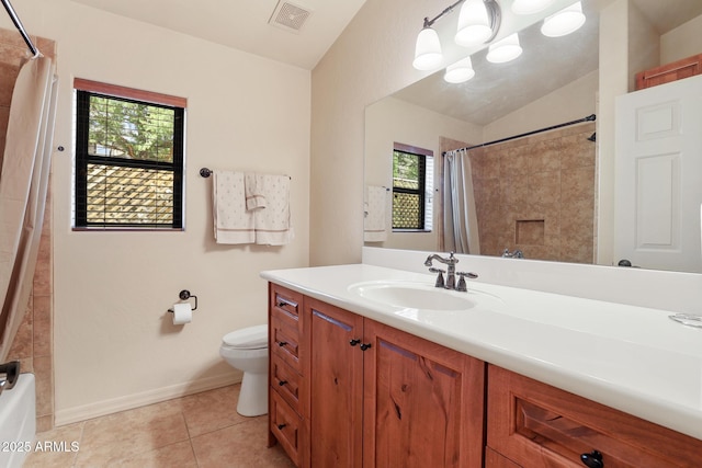 bathroom featuring lofted ceiling, visible vents, toilet, vanity, and tile patterned flooring