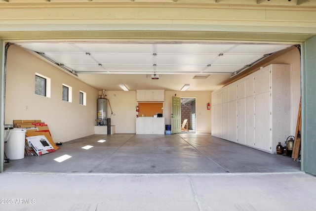 garage with water heater and a garage door opener