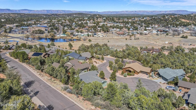 bird's eye view featuring a residential view and a water and mountain view