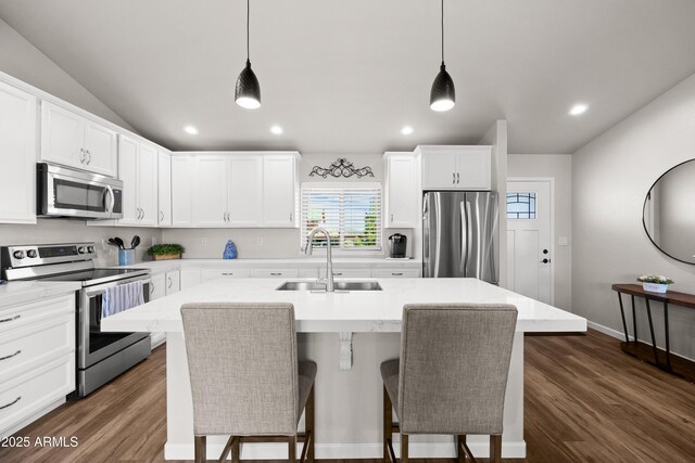 16147 W Apache Way, Peeples Valley, AZ 86332 - kitchen with pendant lighting, a kitchen island with sink, a sink, and stainless steel appliances