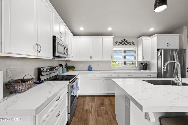16147 W Apache Way, Peeples Valley, AZ 86332 - kitchen with recessed lighting, a sink, white cabinetry, and stainless steel appliances