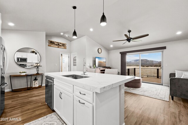 16147 W Apache Way, Peeples Valley, AZ 86332 - kitchen featuring open floor plan, wood finished floors, a sink, and vaulted ceiling