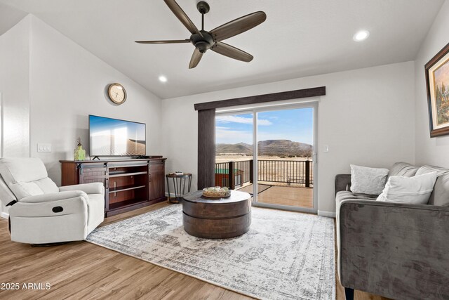 16147 W Apache Way, Peeples Valley, AZ 86332 - living room featuring light wood-style flooring, ceiling fan, lofted ceiling, and recessed lighting