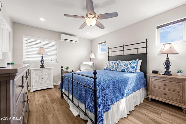 16147 W Apache Way, Peeples Valley, AZ 86332 - bedroom featuring light wood-type flooring, a wall mounted AC, and recessed lighting