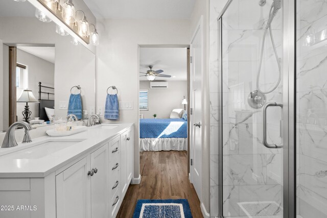 16147 W Apache Way, Peeples Valley, AZ 86332 - full bath featuring a wall mounted air conditioner, ensuite bath, a sink, and a ceiling fan