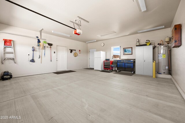 16147 W Apache Way, Peeples Valley, AZ 86332 - garage featuring a garage door opener, water heater, and freestanding refrigerator