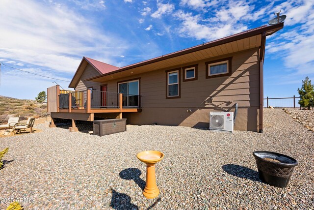 16147 W Apache Way, Peeples Valley, AZ 86332 - rear view of house featuring ac unit, fence, a deck, and metal roof