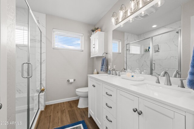 16147 W Apache Way, Peeples Valley, AZ 86332 - full bathroom featuring toilet, double vanity, a sink, and a marble finish shower