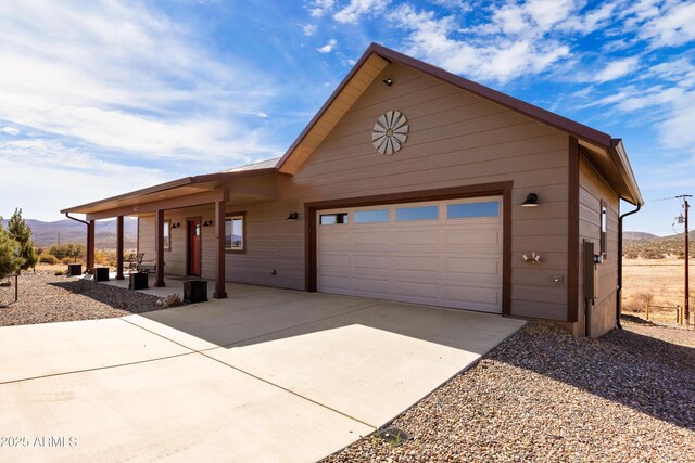 16147 W Apache Way, Peeples Valley, AZ 86332 - exterior space featuring a mountain view, a garage, and concrete driveway