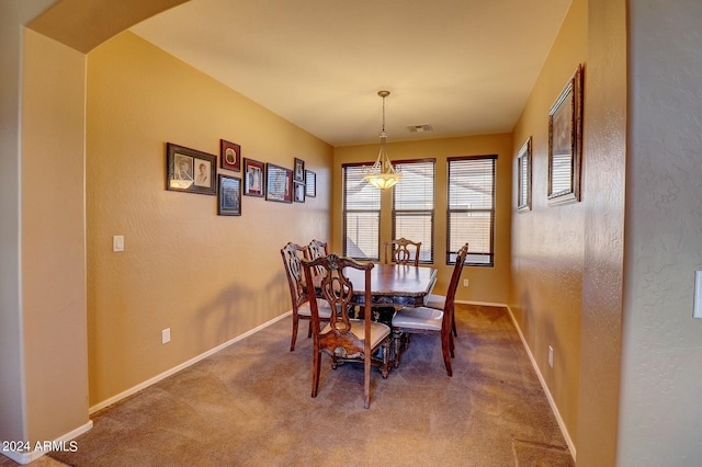 view of carpeted dining room