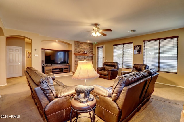 living room featuring light carpet and ceiling fan