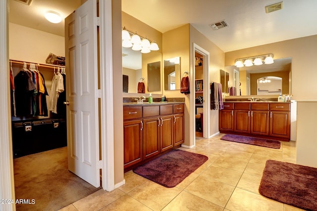 bathroom with tile patterned floors and vanity