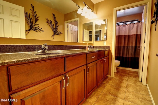 bathroom with tile patterned floors, vanity, a shower with shower curtain, and toilet