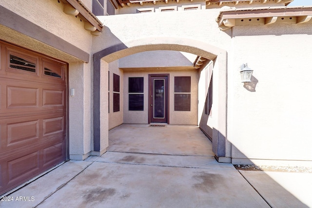 doorway to property featuring a garage