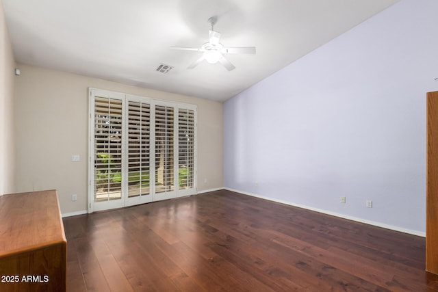 empty room featuring visible vents, ceiling fan, baseboards, and wood finished floors