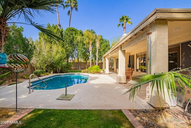 view of pool with a fenced in pool, a fenced backyard, and a patio