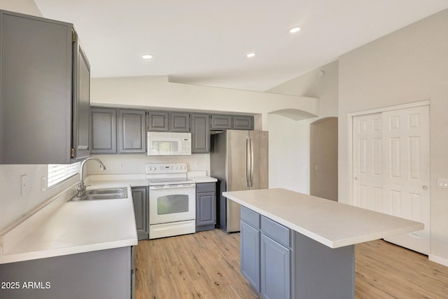 166 W Merrill Ct, Gilbert, AZ 85233 - kitchen with white appliances, gray cabinets, light countertops, lofted ceiling, and recessed lighting
