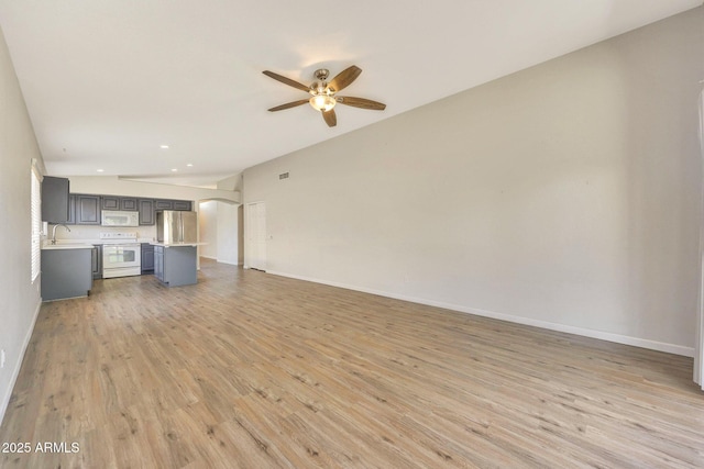 166 W Merrill Ct, Gilbert, AZ 85233 - unfurnished living room featuring ceiling fan, light wood finished floors, and recessed lighting