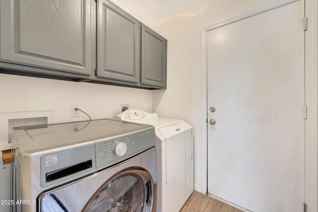 166 W Merrill Ct, Gilbert, AZ 85233 - laundry room with separate washer and dryer, cabinet space, and light wood-style flooring