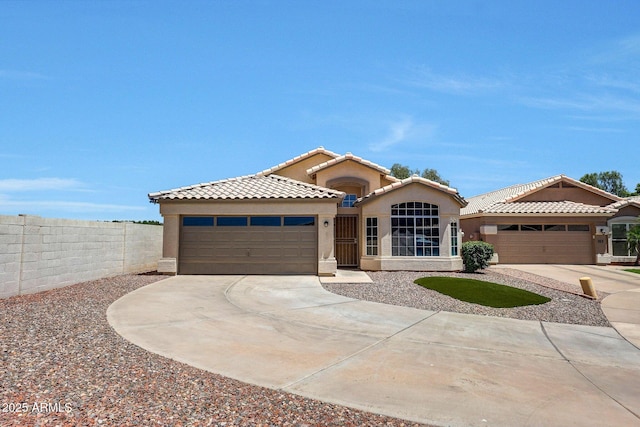 166 W Merrill Ct, Gilbert, AZ 85233 - mediterranean / spanish-style house featuring an attached garage, concrete driveway, stucco siding, and a tiled roof