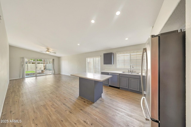 166 W Merrill Ct, Gilbert, AZ 85233 - kitchen featuring appliances with stainless steel finishes, gray cabinetry, light countertops, a ceiling fan, and light wood finished floors