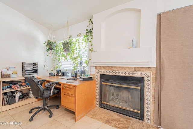 office area featuring light tile patterned floors and a fireplace