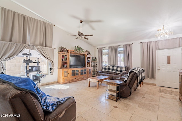 living room with light tile patterned flooring, ceiling fan with notable chandelier, and vaulted ceiling