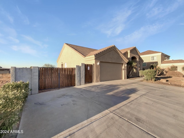 mediterranean / spanish-style house featuring a garage