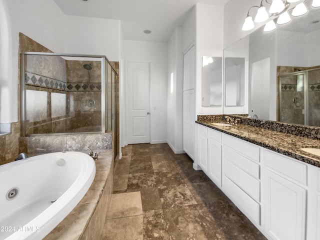 bathroom featuring vanity and independent shower and bath