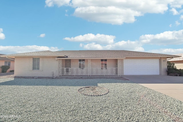 view of front of property with a porch and a garage