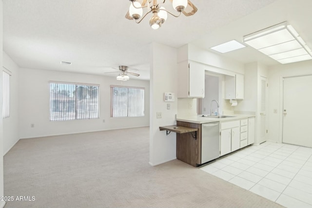 kitchen featuring white cabinetry, dishwasher, sink, light colored carpet, and ceiling fan with notable chandelier