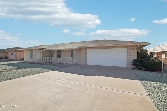 view of front of property featuring a porch and a garage