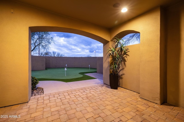 view of patio / terrace featuring fence