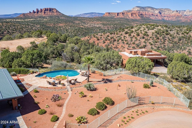 birds eye view of property with a mountain view