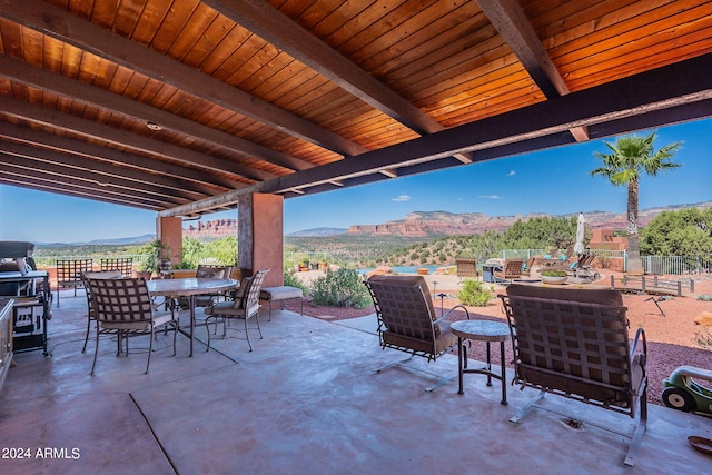 view of patio / terrace featuring a mountain view