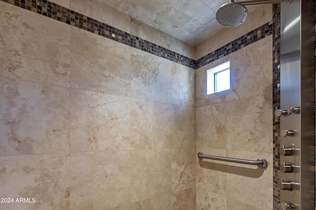 bathroom with tiled shower