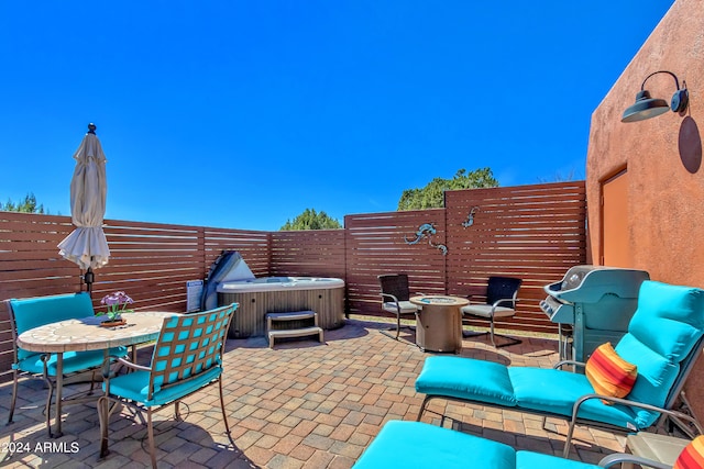 view of patio featuring a hot tub