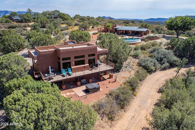 birds eye view of property featuring a mountain view