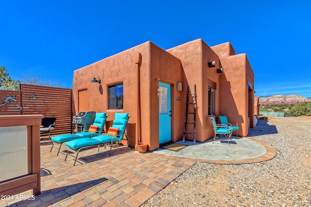 rear view of house featuring a patio area