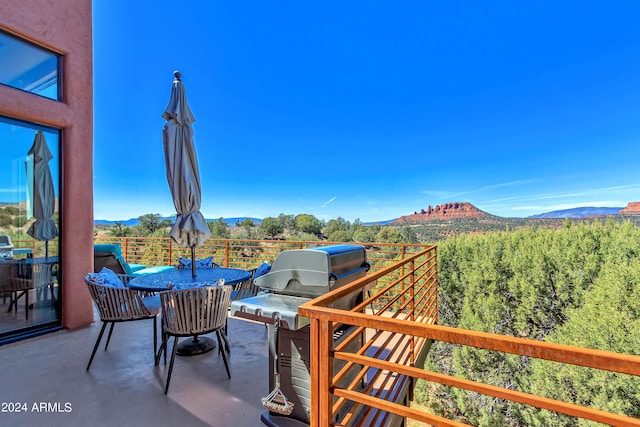 view of patio / terrace featuring a balcony and a mountain view