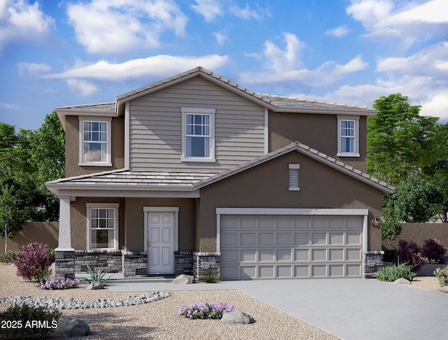 traditional-style home featuring driveway, stone siding, a garage, and stucco siding