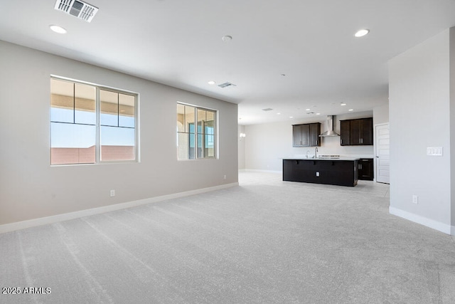 12219 W Caraveo Pl, Peoria, AZ 85383 - unfurnished living room with light carpet, recessed lighting, and baseboards