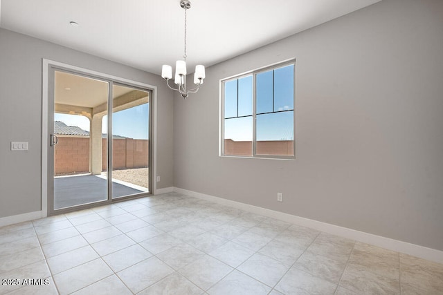 12219 W Caraveo Pl, Peoria, AZ 85383 - empty room with a chandelier, baseboards, and light tile patterned floors