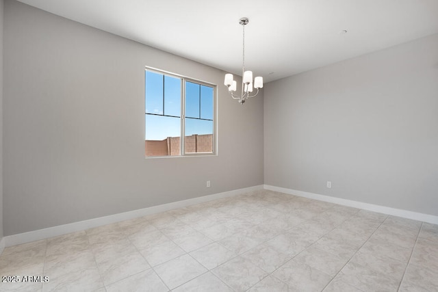 12219 W Caraveo Pl, Peoria, AZ 85383 - empty room featuring a chandelier and baseboards