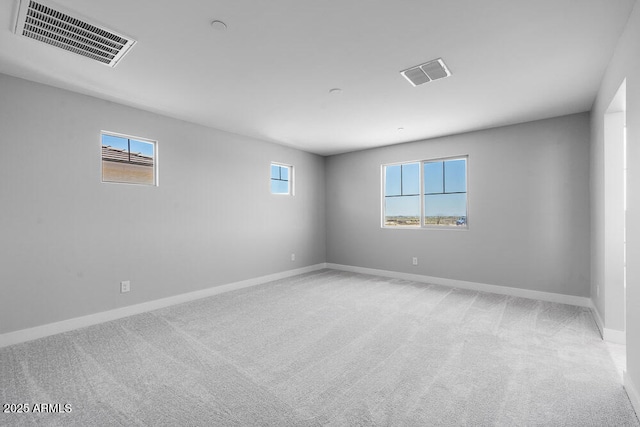12219 W Caraveo Pl, Peoria, AZ 85383 - empty room featuring light carpet and baseboards