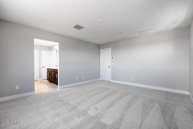 12219 W Caraveo Pl, Peoria, AZ 85383 - spare room featuring light colored carpet and baseboards