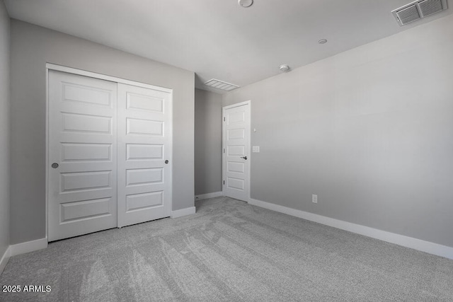 12219 W Caraveo Pl, Peoria, AZ 85383 - unfurnished bedroom with carpet flooring, baseboards, and a closet